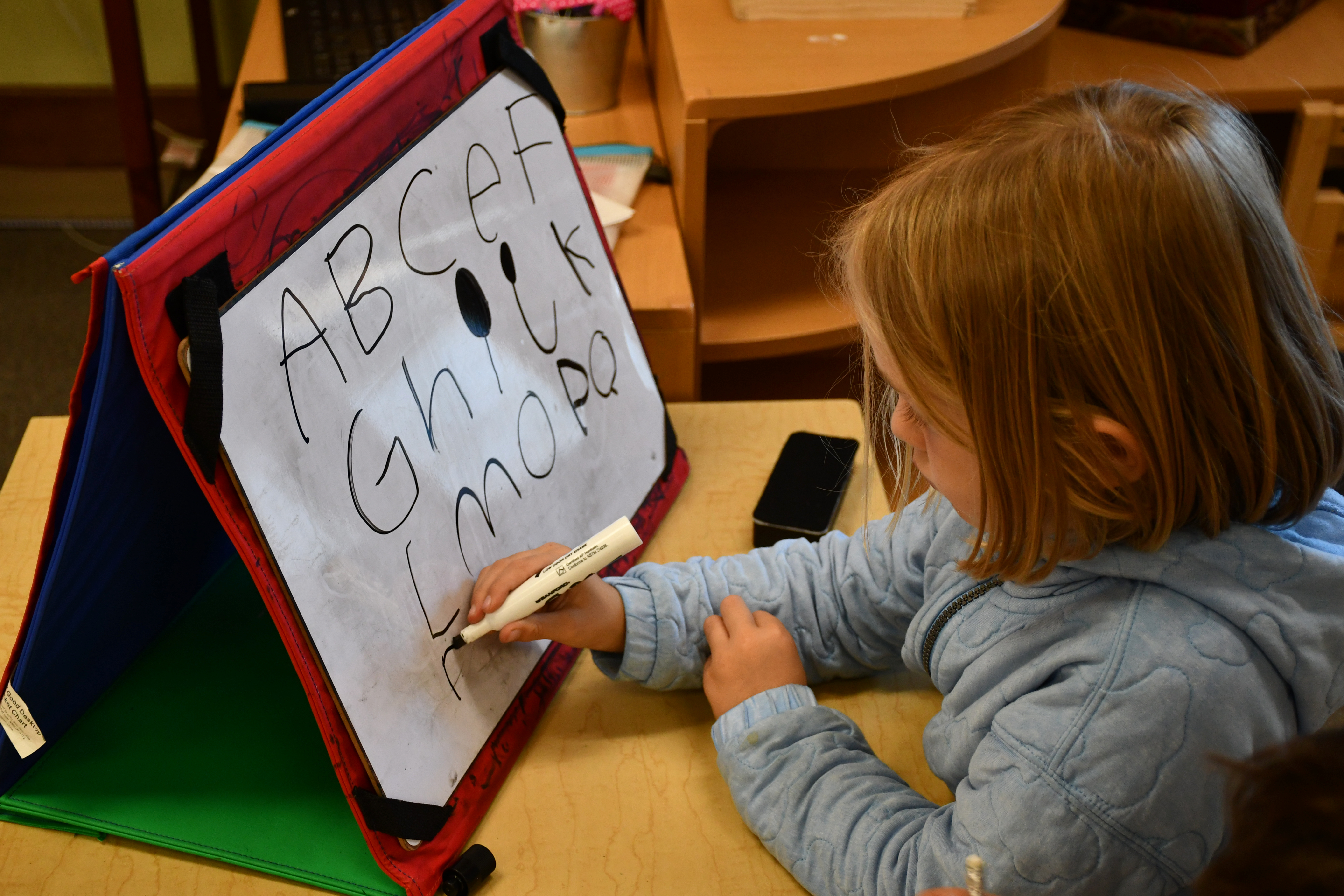 Baywood Elementary student practicing the alphabet [photo courtesy of Sunshine Frawley]